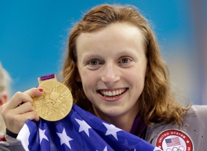 United States' Katie Ledecky holds up her gold medal after winning the women's 800-meter freestyle swimming final at the Aquatics Centre in the Olympic Park during the 2012 Summer Olympics in London, Friday, Aug. 3, 2012. (AP Photo/Lee Jin-man)